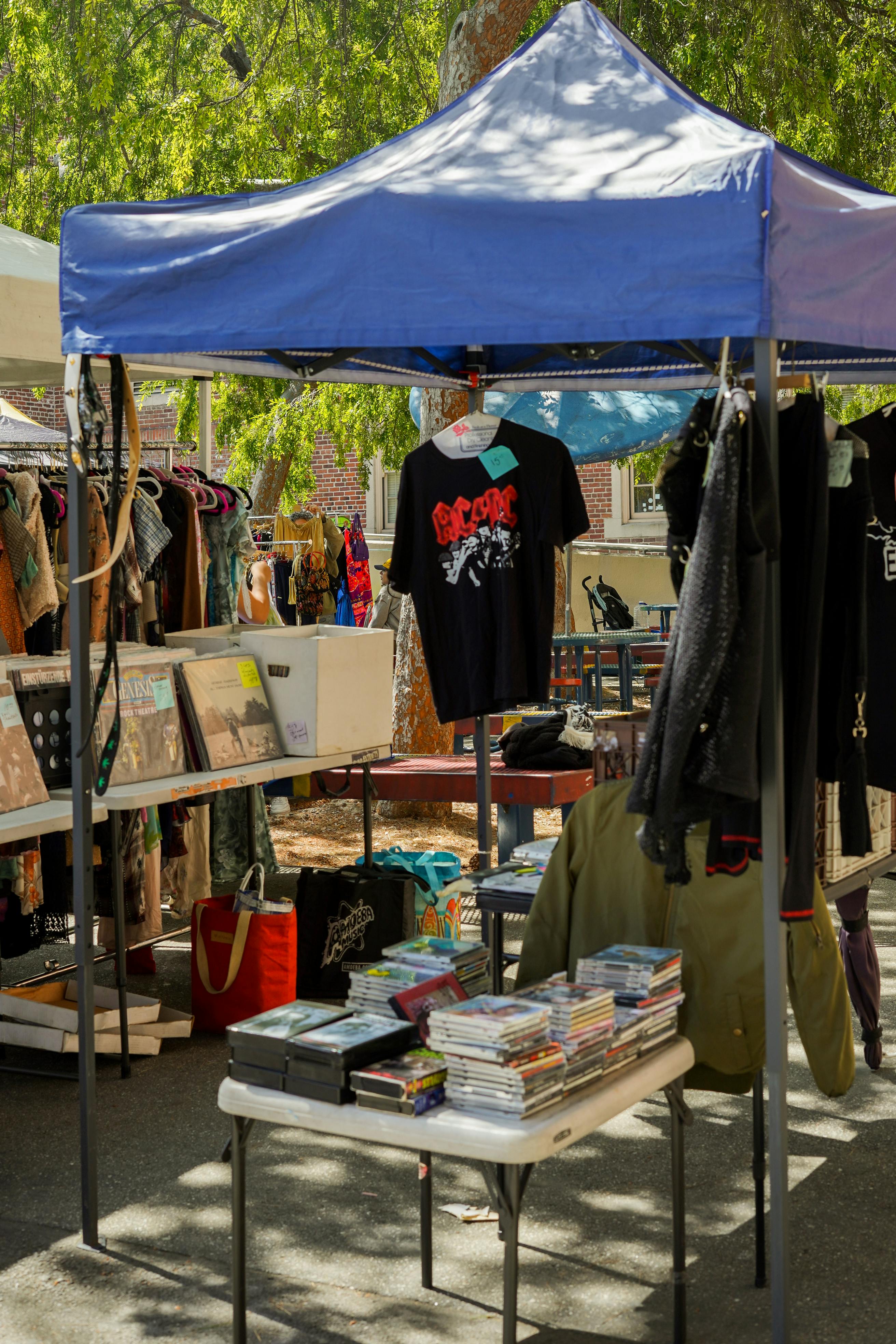 People browsing a local community market
